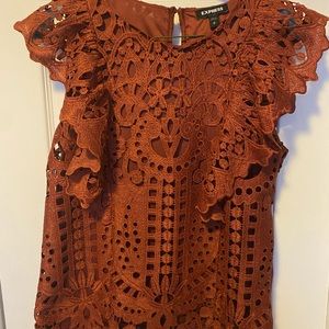 Sleeveless burnt orange blouse. Never worn. New with tag.